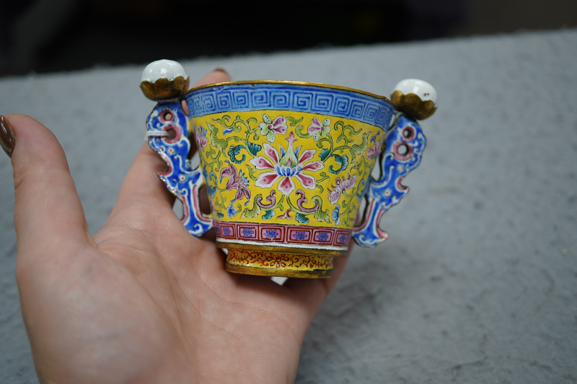 A Chinese Guangzhou enamel two handled wine cup, four character Qianlong mark and of the period (1736-1795)